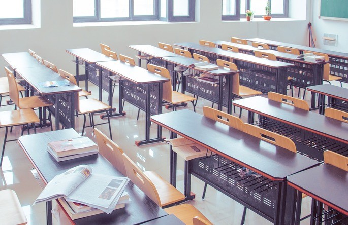 classroom with desks books and chairs as discrete quantitative variables.
